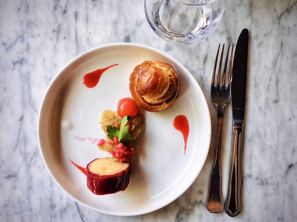 What should you consider about local culinary specialties when booking a holiday rental in Cornwall?